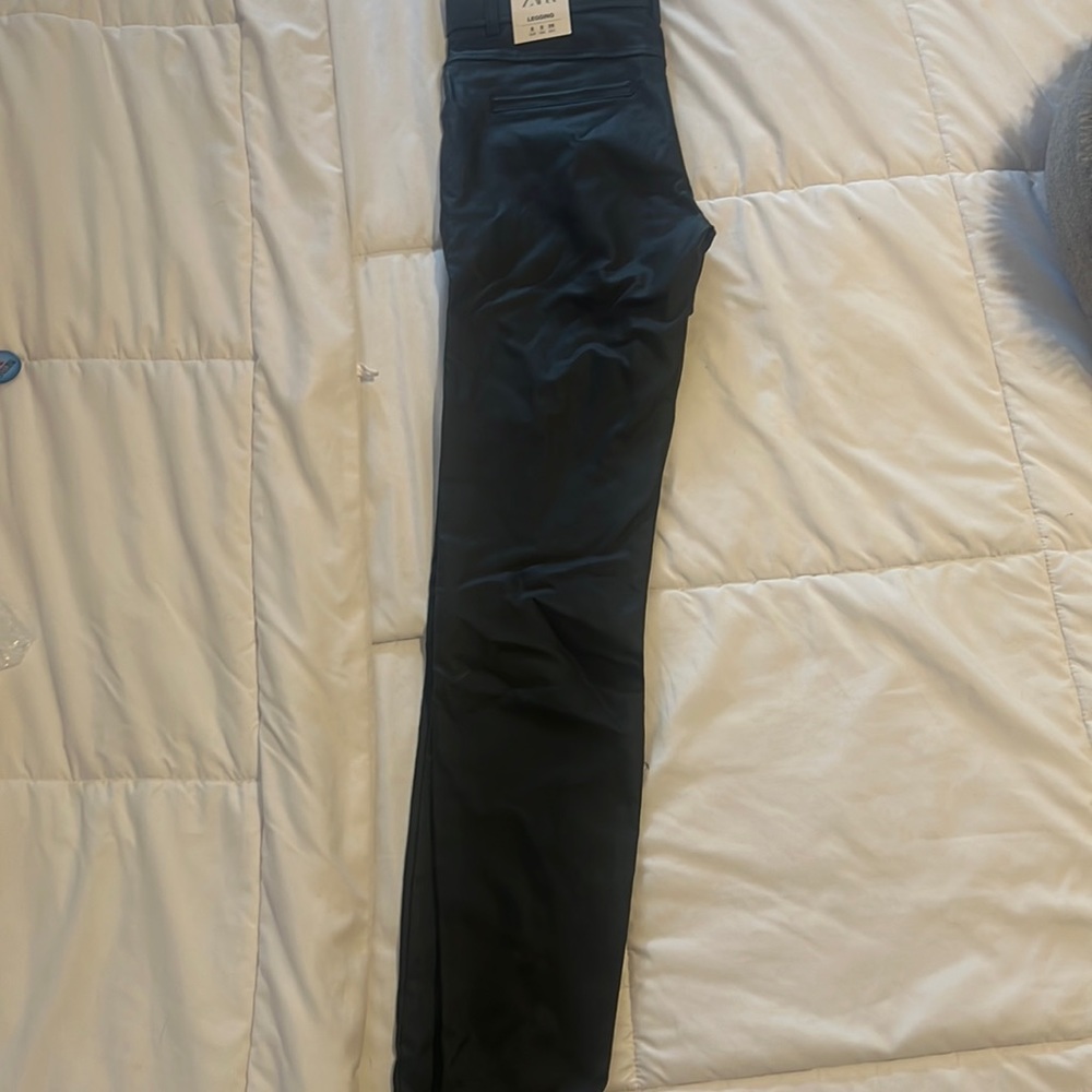 Black leather like skinny pants